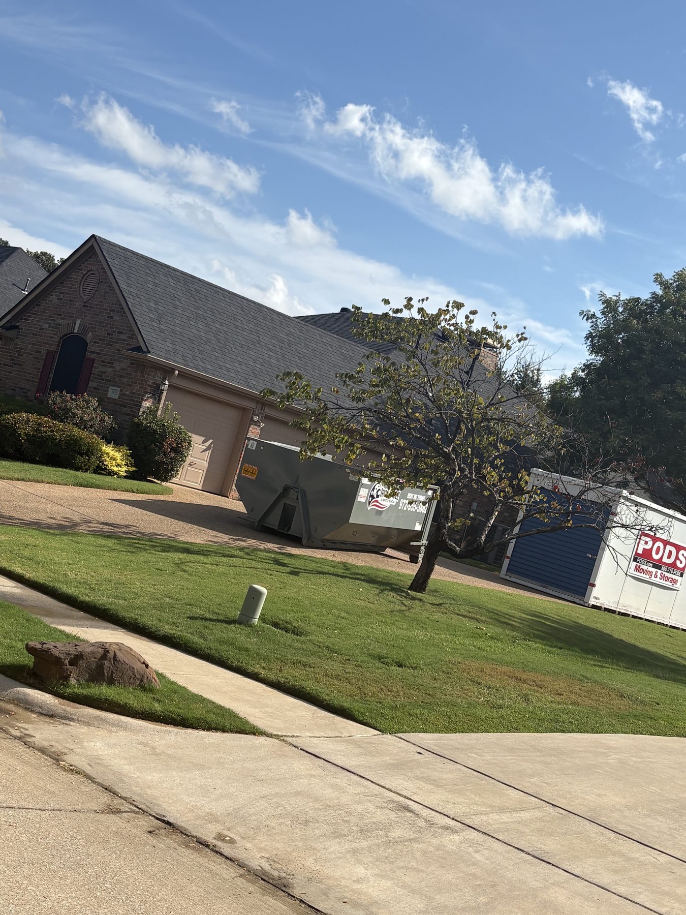 Iron Eagle Dumpster Rentals dumpster on residential driveway in Denton County